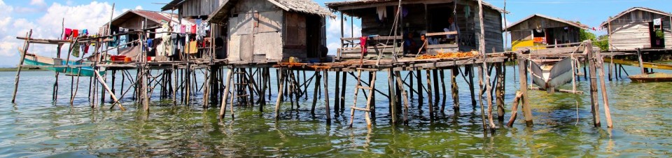 Homes in an indigenous Bajau Laut community sit on stilts on built on stilts above the waters off the eastern coast of the town of Semporna, in Sabah State in East Malaysia on the island of Borneo.
