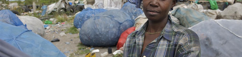 Zena Rishya stands among bags of recyclables near the shack where she lives in the Mtoni landfill, the main dumpsite for the city of Dar es Salaam. 
